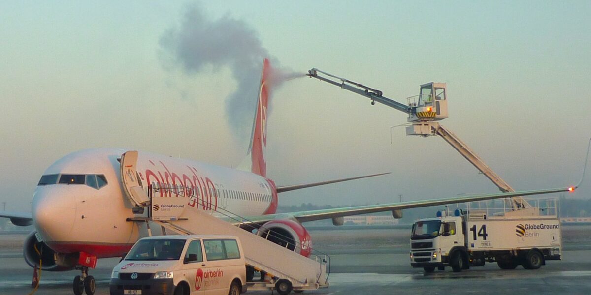 Commercial airplane being de-iced during winter weather operations