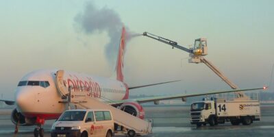 Commercial airplane being de-iced during winter weather operations