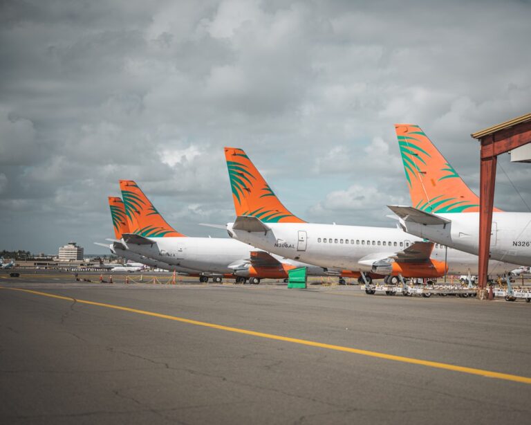 Multiple planes lined up on airport tarmac illustrating capacity constraints